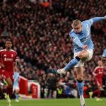 Manchester City players celebrate a late comeback at Anfield as VAR drama unfolds during the Premier League clash against Liverpool.