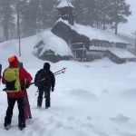 Rescue team searches for skiers in deep snow near Lake Tahoe after avalanche