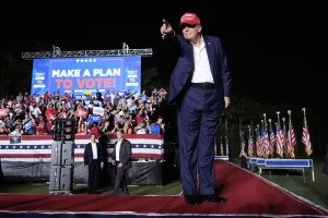 Donald Trump gestures to supporters during campaign rally at Trump National Doral Miami Tuesday