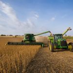 US farmers working in fields amid rising challenges
