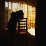 A person standing alone reflecting on fear and growth