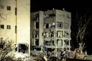 Emergency responders at southern Israeli town after Iranian missile attack injuring 160 people near nuclear site