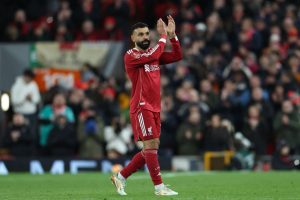 Mohamed Salah waving to Liverpool supporters at Anfield