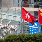 Hong Kong Stock Exchange Exchange Square building showing Chinese tech companies listing.
