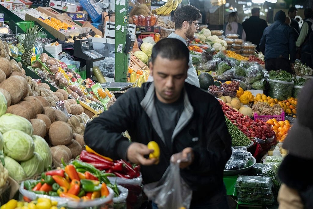 Farmers inspecting crops amid rising food costs caused by Iran war