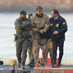 Nicolas Maduro in handcuffs escorted by federal agents in New York