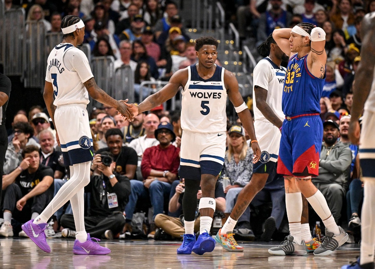 Anthony Edwards of Minnesota Timberwolves shaking hands with Jaden McDaniels after a foul during NBA playoff game against Denver Nuggets