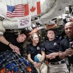 NASA Artemis II lunar mission crew returning to Earth after Moon flyby in Orion spacecraft