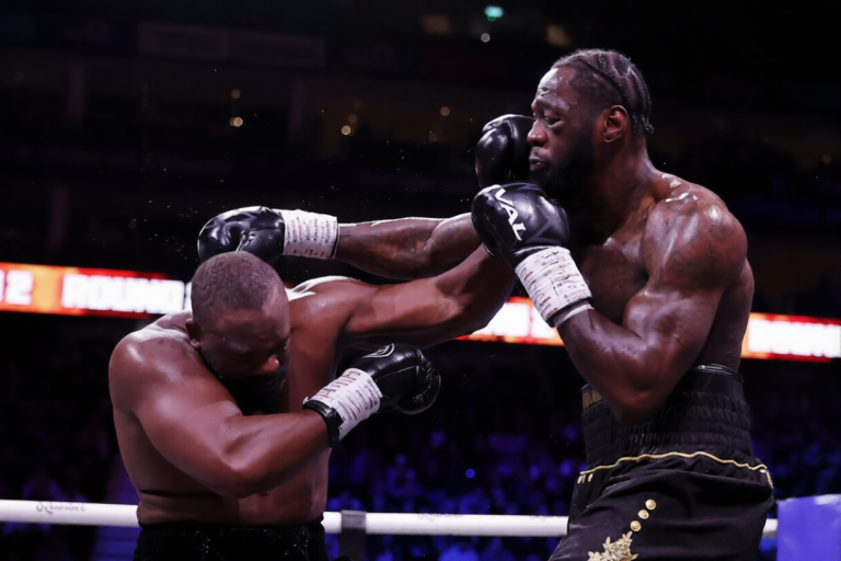 Derek Chisora punches Deontay Wilder during their heavyweight fight at The O2 Arena in London on April 4, 2026.