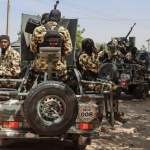 Nigerian soldiers patrol in Maiduguri after March 2026 triple suicide bombing in Borno state.
