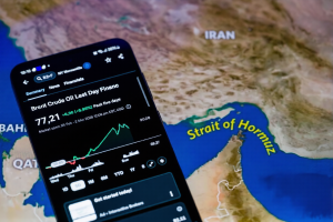 Brent crude oil price chart on mobile phone amid Iran conflict oil market volatility