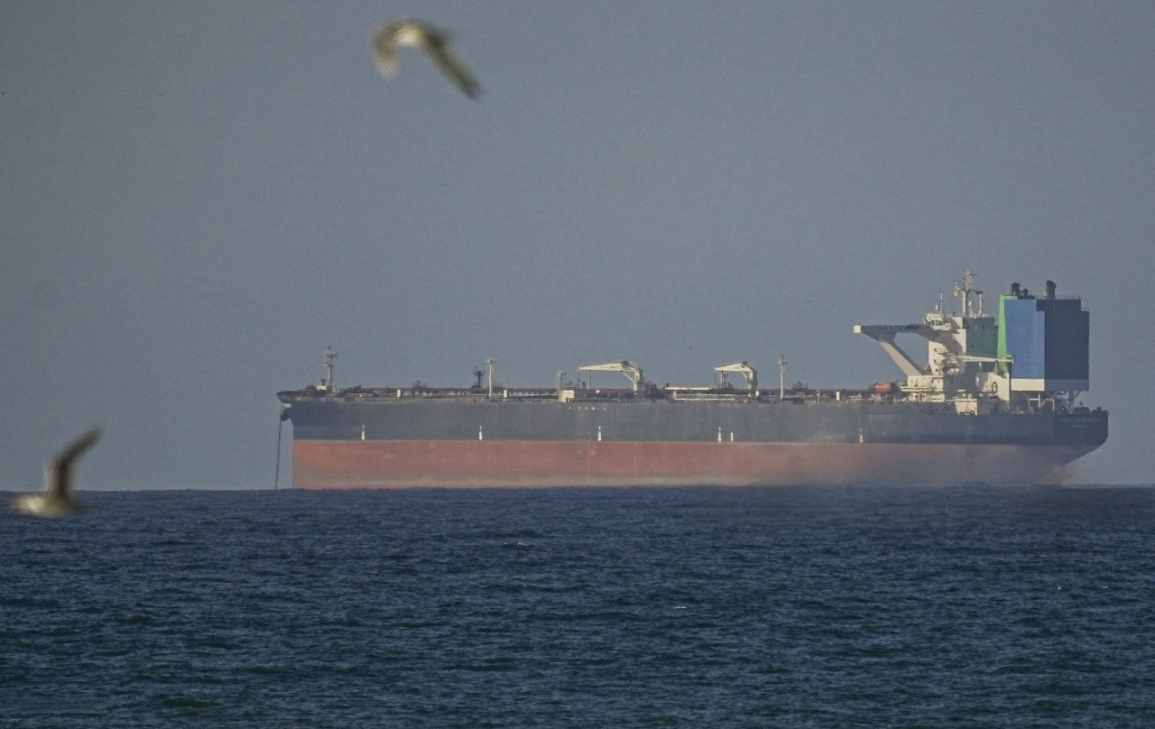 Vessels passing through the Strait of Hormuz near Oman after US-Iran ceasefire reopening agreement in 2026