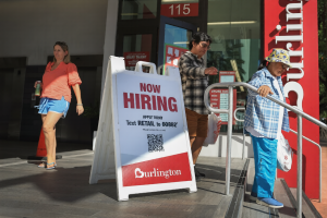 Now Hiring sign outside U.S. retail store representing job growth in March 2026